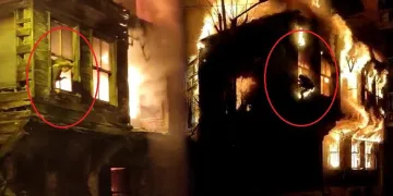 Yanan binanın penceresinden atlayarak kurtuldular