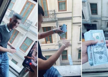 Pencereden dolar saçan yabancı uyruklu yakalandı