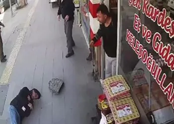 Üstüne asfalt parçası düştü