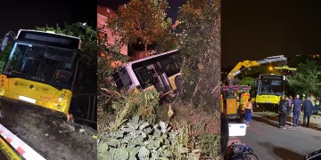 Freni boşalan otobüs bir evin bahçesine düştü