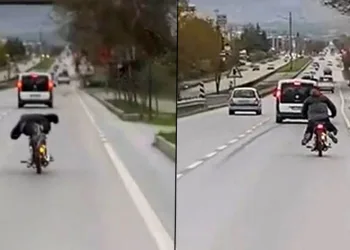 Motosikleti yatarak sürüp tehlike saçtı