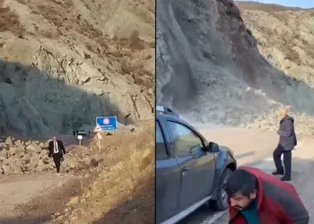 Heyelana aldırış etmeden yürüdü