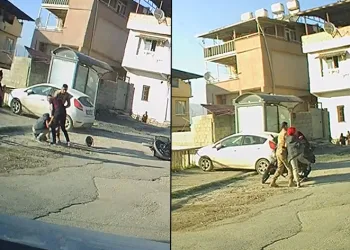 Kadın ile erkeğin kasklı ve tekmeli kavgası