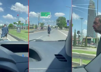 Ameliyathane önlüğüyle karayolunda metrelerce yürüdü