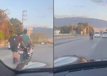 Motosiklete tutunan patenli genç ölüme meydan okudu