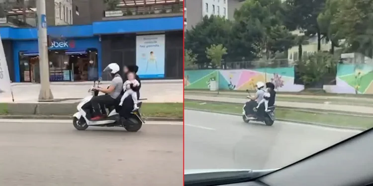 Motosiklet üzerinde kucağında bebekle seyretti
