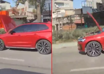 Bursa’da bir otomobil kaputu açık şekilde ilerledi