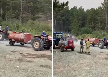 Bursa’da çiftçi patlak tekerlek ile yangına su taşıdı