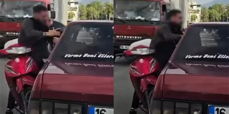 Bursa’da motosikletli aracın camından içeri girmeye çalıştı