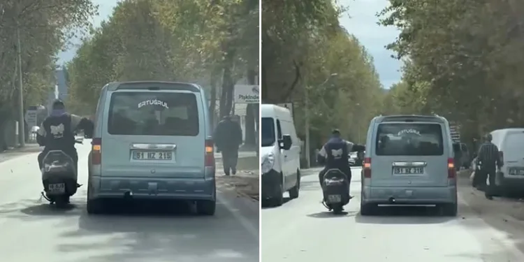 Bursa’da sohbet etmek için seyir halindeki araca yaslandı